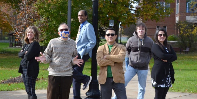 Six members of Mathematics faculty posing on campus