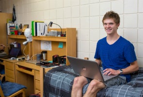 Student near desk in College Hall room