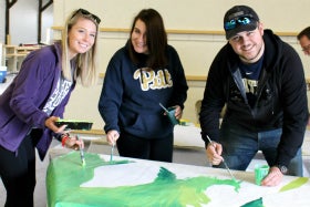 Pitt-Greensburg students painting mural
