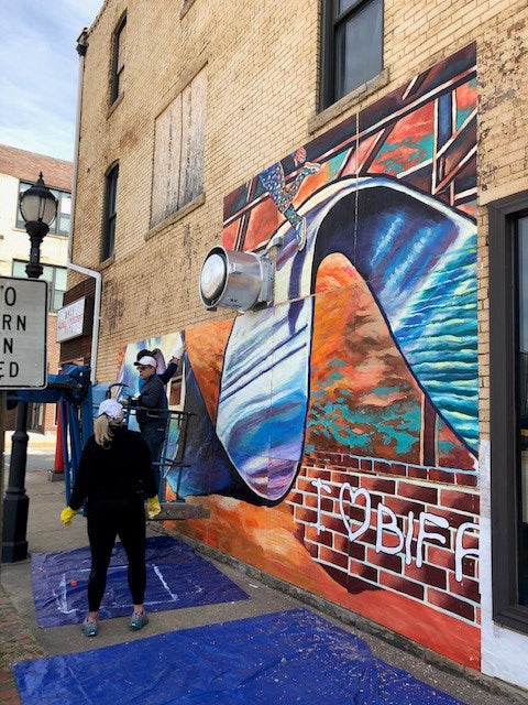 People painting mural