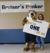 Bruiser posing with student