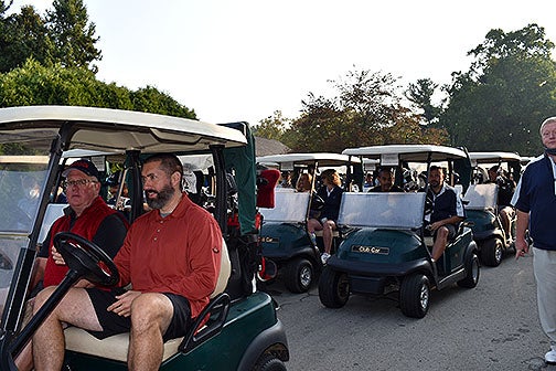 Golfers in golf carts ready for the shot gun start