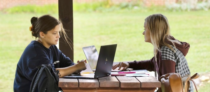 Two students using laptops