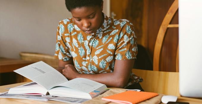 student reading a textbook