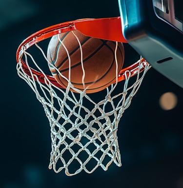 Basketball entering a hoop