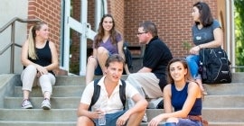 Group of students sitting on stairs